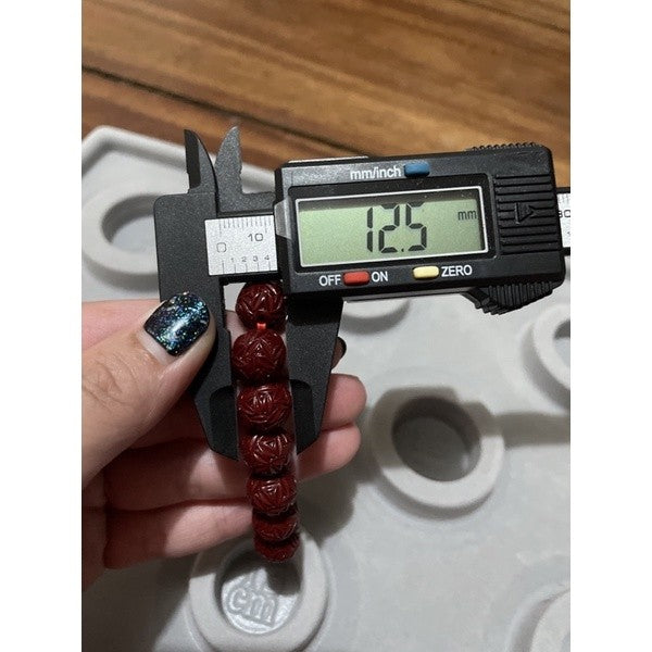 cinnabar bracelet with flower carvings