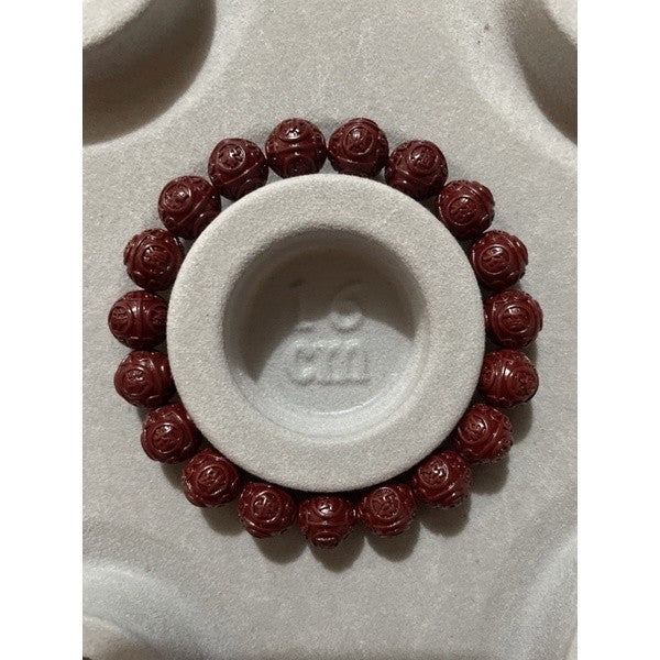Cinnabar bracelet with chinese carving