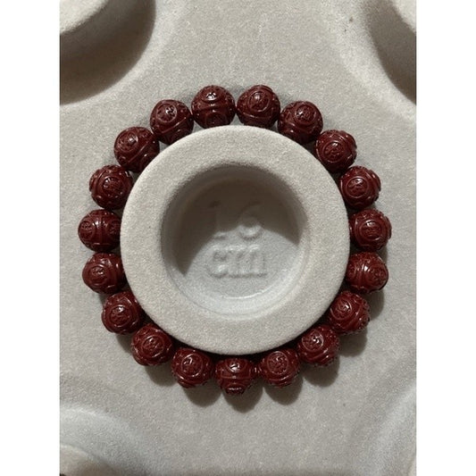 Cinnabar bracelet with chinese carving