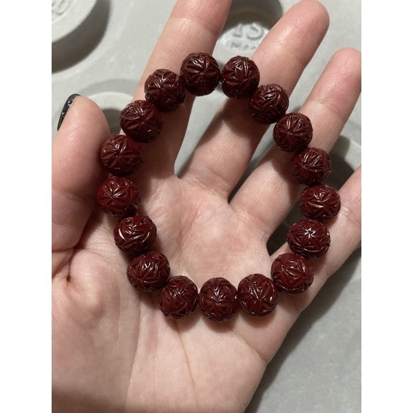 cinnabar bracelet with flower carvings