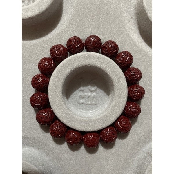 cinnabar bracelet with flower carvings